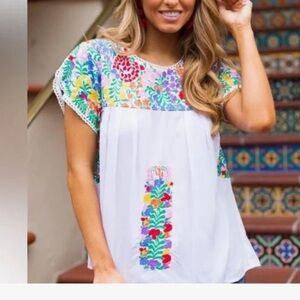 J. Marie embroidered top size medium.  Generously sized.